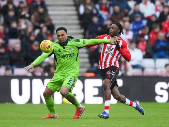 Kenny Tete of Fulham fends off Romaine Mundle of Sunderland Sunderland v Fulham, Premier League, Football, Stadium of Light, Sunderland, UK - 22 Feb 2026Sunderland Stadium of Light United Kingdom EDITORIAL USE ONLY No use with unauthorised audio, video, data, fixture lists, club league logos or live services. Online in-match use limited to 120 images, no video emulation. No use in betting, games or single club league player publications. Copyright: xRichardxLee Shutterstockx 16681560bj