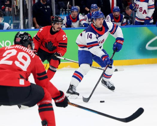February 22, 2026, Milan, Lombardy, Italy: Brock Faber (14) of Team United States against Team Canada in the men s Ice hockey, Eishockey gold medal game during the Milano Cortina 2026 Olympic Winter games, Winterspiele,Spiele, Summer games at Milano Santagiulia Ice Hockey Arena. Milan Italy - ZUMAm117 20260222_oly_m117_030 Copyright: xDavidxMcIntyrex