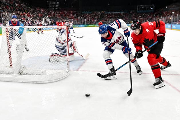 MILAN, ITALY - FEBRUARY 22: Nathan MacKinnon of Canada R) and Charlie McAvoy of United States L) battle for the puck during the Ice hockey, Eishockey Men™s Gold Medal Game match between Canada and USA on day sixteen of the Milano Cortina 2026 Winter Olympic Games, Olympische Spiele, Olympia, OS at Milano Santagiulia Ice Hockey Arena on February 22, 2026 in Milan, Italy. Milan Milano Santagiulia Ice Hockey Arena Italy *** MILAN, ITALY FEBRUARY 22 Nathan MacKinnon of Canada R and Charlie McAvoy of United States L battle for the puck during the Ice Hockey Men™s Gold Medal Game match between Canada and USA on day sixteen of the Milano Cortina 2026 Winter Olympic games at Milano Santagiulia Ice Hockey Arena on February 22, 2026 in Milan, Italy Milan Milano Santagiulia Ice Hockey Arena Italy Copyright: xJustPictures.ch AndreaxBrancax jp-en-EuSpIm-AB-DSC_570422022026
