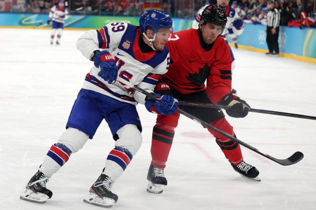 Milano Cortina 2026, Milan, Italy, 22.02, 2026, MiCo2026, MiCo, 2026, Olympics, Olympic, Winter Olympic, Olympic Winter games, Winterspiele,Spiele, Summer games Ice hockey, Eishockey hockey, USA, Canada, final Jake Guentzel of United States and Devon Toews of Canada in action during Ice Hockey final game between Canada and United States of Milano Cortina 2026 Olympic Winter Games in Milan, Italy, 22.02.2026. Photo: Roman Koksarov (RKF) Milan Italy Copyright: xRomanxKoksarovx 0B4A9780.JPG