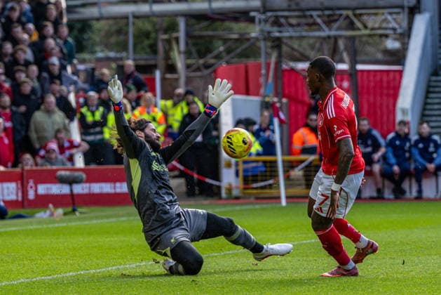 22nd February 2026; The City Ground, Nottingham, England; Premier League Football, Nottingham Forest versus Liverpool; Callum Hudson-Odoi of Nottingham Forest sees his shot blocked by Alisson Becker of Liverpool  GodfreyxPitt Content restricted for UK based newspaper