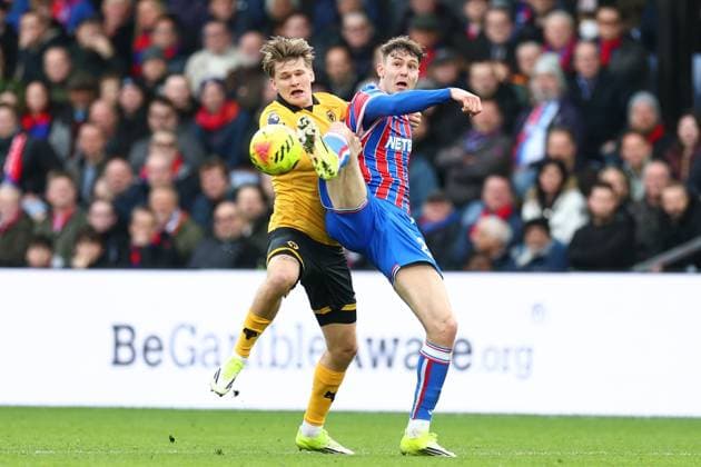 Jorgen Strand Larsen of Crystal Palace under pressure from David Moller Wolfe of Wolverhampton Wanderers Crystal Palace v Wolverhampton Wanderers, Premier League, Football, Selhurst Park, London, UK - 22 Feb 2026London Selhurst Park United Kingdom EDITORIAL USE ONLY No use with unauthorised audio, video, data, fixture lists, club league logos or live services. Online in-match use limited to 120 images, no video emulation. No use in betting, games or single club league player publications. Copyright: xSimonxDael Shutterstockx 16681548ax