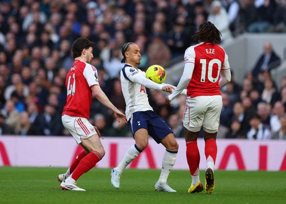 22nd February 2026; Tottenham Hotspur Stadium, London, England; Premier League Football, Tottenham Hotspur versus Arsenal; Xavi Simons of Tottenham Hotspur under pressure from Declan Rice and Eberechi Eze of Arsenal  JPxFletcher Content restricted for UK based newspaper