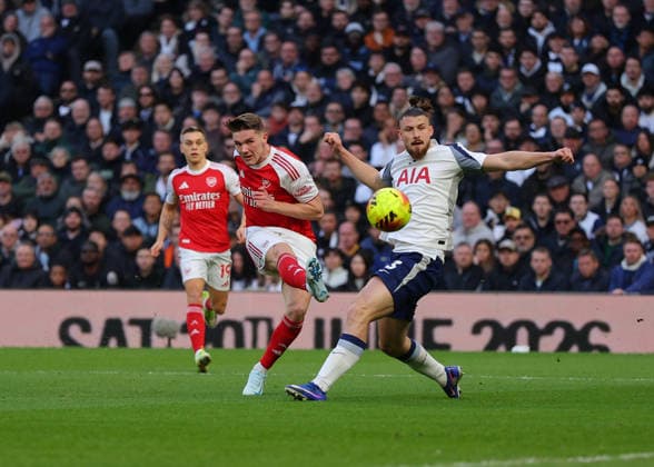 22nd February 2026; Tottenham Hotspur Stadium, London, England; Premier League Football, Tottenham Hotspur versus Arsenal; Viktor Gyokeres of Arsenal takes a shot on goal past Radu Dragusin of Tottenham Hotspur  JPxFletcher Content restricted for UK based newspaper