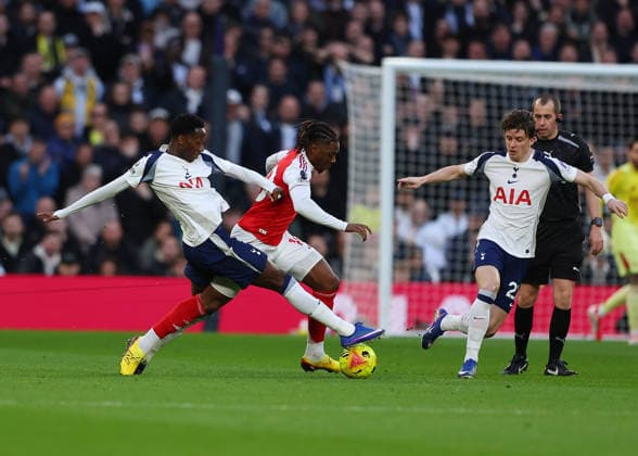 22nd February 2026; Tottenham Hotspur Stadium, London, England; Premier League Football, Tottenham Hotspur versus Arsenal; Eberechi Eze of Arsenal under pressure from Pape Matar Sarr and Conor Gallagher of Tottenham Hotspur  JPxFletcher Content restricted for UK based newspaper