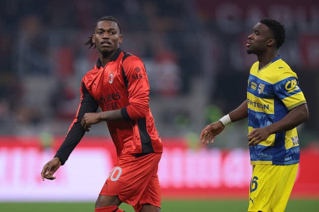 Milan, Italy, 22nd February 2026. Rafael Leao of AC Milan and Mandela Keita of Parma Calcio during the AC Milan vs Parma Serie A match at Giuseppe Meazza, Milan. Picture credit should read: Jonathan Moscrop Sportimage EDITORIAL USE ONLY. No use with unauthorised audio, video, data, fixture lists, club league logos or live services. Online in-match use limited to 120 images, no video emulation. No use in betting, games or single club league player publications. SPI_010_MILAN_PARMA SPI-4549-0010
