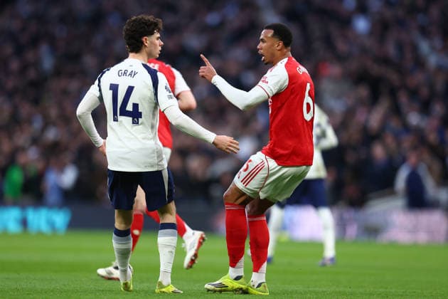 London, England, 22nd February 2026. Archie Gray of Tottenham Hotspur and Gabriel of Arsenal clash during the Tottenham Hotspur vs Arsenal Premier League match at the Tottenham Hotspur Stadium, London. Picture credit should read: Paul Terry Sportimage EDITORIAL USE ONLY. No use with unauthorised audio, video, data, fixture lists, club league logos or live services. Online in-match use limited to 120 images, no video emulation. No use in betting, games or single club league player publications. SPI_027_PT_Tottenham_Arsenal SPI-4545-0027