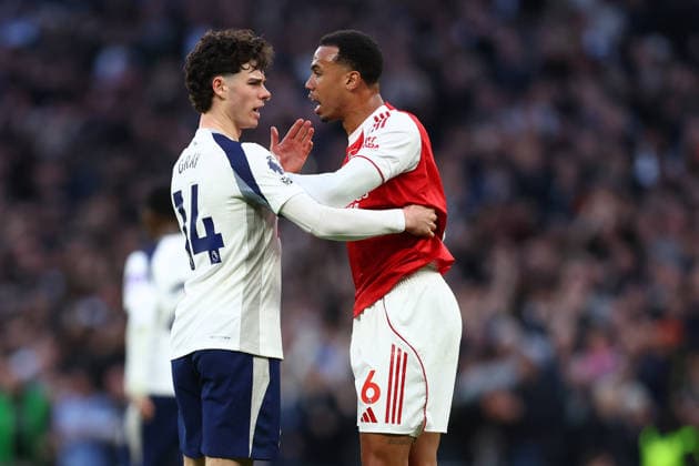 London, England, 22nd February 2026. Archie Gray of Tottenham Hotspur and Gabriel of Arsenal clash during the Tottenham Hotspur vs Arsenal Premier League match at the Tottenham Hotspur Stadium, London. Picture credit should read: Paul Terry Sportimage EDITORIAL USE ONLY. No use with unauthorised audio, video, data, fixture lists, club league logos or live services. Online in-match use limited to 120 images, no video emulation. No use in betting, games or single club league player publications. SPI_028_PT_Tottenham_Arsenal SPI-4545-0028