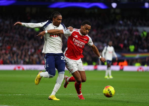 22nd February 2026; Tottenham Hotspur Stadium, London, England; Premier League Football, Tottenham Hotspur versus Arsenal; Jurrien Timber of Arsenal under pressure from Yves Bissouma of Tottenham Hotspur  JPxFletcher Content restricted for UK based newspaper