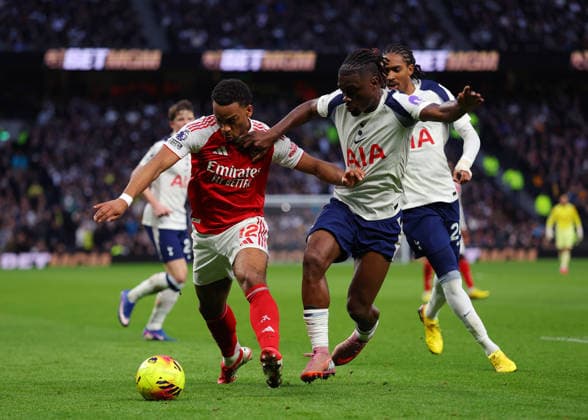 22nd February 2026; Tottenham Hotspur Stadium, London, England; Premier League Football, Tottenham Hotspur versus Arsenal; Jurrien Timber of Arsenal under pressure from Yves Bissouma of Tottenham Hotspur  JPxFletcher Content restricted for UK based newspaper