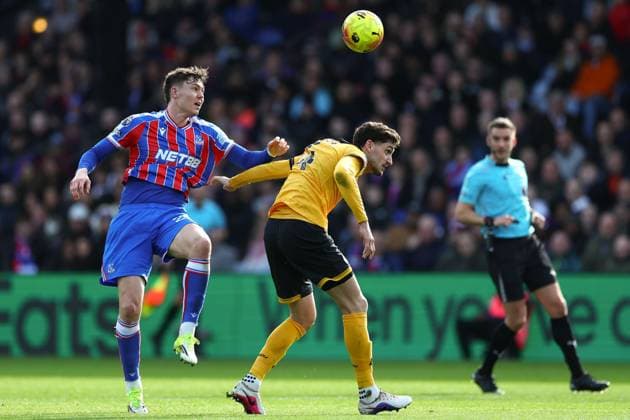 Jorgen Strand Larsen of Crystal Palace and Santiago Bueno of Wolverhampton Wanderers battle for the ball Crystal Palace v Wolverhampton Wanderers, Premier League, Football, Selhurst Park, London, UK - 22 Feb 2026London Selhurst Park United Kingdom EDITORIAL USE ONLY No use with unauthorised audio, video, data, fixture lists, club league logos or live services. Online in-match use limited to 120 images, no video emulation. No use in betting, games or single club league player publications. Copyright: xSimonxDael Shutterstockx 16681548cj