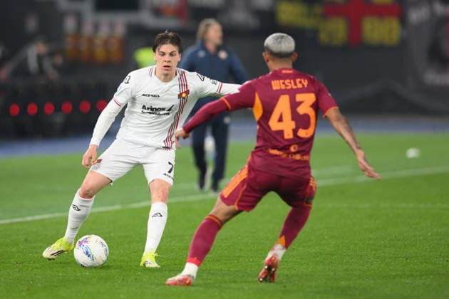 22nd February 2026, Stadio Olimpico, Rome, Italy; Serie A Football; Roma versus Cremonense; Alessio Zerbin of US Cremonese under pressure from Wesley of AS Roma  AllShotLive Content restricted for UK based newspaper