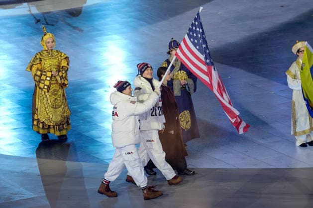 Ethan Bates and Hilary Knight of Team United States carry the American flag into the Closing Ceremony of the Milano Cortina 2026 Olympic Games, Olympische Spiele, Olympia, OS at Verona Arena in Verona, Italy, on Sunday, February 22, 2026. Norway won the most medals with a total of 41, with the United States following at 33.  ITA20260222120 AARONxJOSEFCZYK