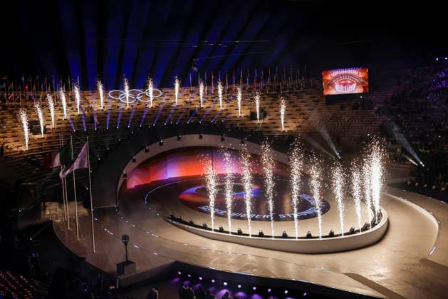 Flames illuminate the stage as Faster. Higher. Stronger-Together. is displayed during the Closing Ceremony of the Milano Cortina 2026 Olympic Games, Olympische Spiele, Olympia, OS at Verona Arena in Verona, Italy, on Sunday, February 22, 2026. Norway won the most medals with a total of 41, with the United States following at 33.  ITA20260222147 AARONxJOSEFCZYK