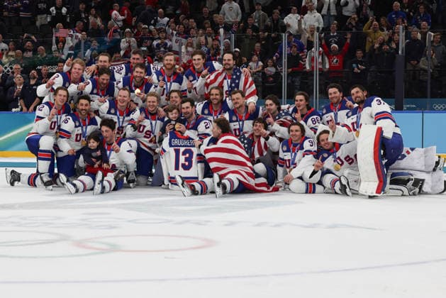 February 22, 2026: Team United States poses with the children of Johnny Gaudreau and his number 13 jersey after winning the Gold medal in the Mens Ice hockey, Eishockey Gold Medal game between Canada and USA held at Milano Santagiulia Ice Hockey Arena during the Milano Cortina 2026 Olympic Games, Olympische Spiele, Olympia, OS in Milan, Italy. MilanoCortina2026 Olympics Milano Cortina 2026: Gold Medal Game Mens Ice Hockey Canada Vs United States Feb 22  - ZUMAc04_ 20260222_zma_c04_102 Copyright: xDanielxLeax