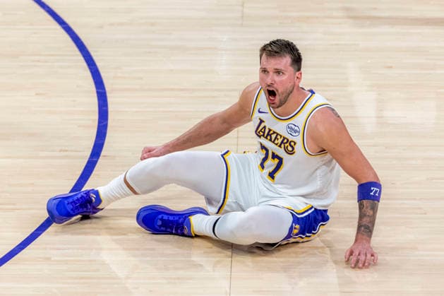 February 22, 2026, Los Angeles, California, USA: Los Angeles LakersÃ¢â‚¬â ¢ Luka DonÄÂiÄ¡ (77) reacts during an NBA, Basketball Herren, USA basketball game against the Boston Celtics at Crypto.com Arena on Sunday, Feb. 22, 2026 in Los Angeles. NBA 2026: Celtics 111: 89 Lakers  - ZUMAc68_ 20260222_zaf_c68_039 Copyright: xRingoxChiux