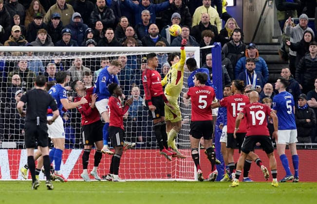 Liverpool, England, 23rd February 2026. Casemiro of Manchester United, ManU and Senne Lammens of Manchester United combine to keep out an Everton corner during the Everton vs Manchester United Premier League match at Hill Dickinson Stadium, Liverpool. Picture credit should read: Andrew Yates Sportimage EDITORIAL USE ONLY. No use with unauthorised audio, video, data, fixture lists, club league logos or live services. Online in-match use limited to 120 images, no video emulation. No use in betting, games or single club league player publications. SPI_046_AY_Everton_Man_Utd SPI-4547-0046