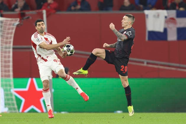 Mehdi Taremi (Olympiacos FC) und Alejandro Grimaldo (Bayer 04 Leverkusen) battle for the ball during the UEFA Champions League 2025 26 League Knockout Play-off Second Leg match between Bayer 04 Leverkusen and Olympiacos FC at BayArena on February 24, 2026 in Leverkusen, Germany. (Photo by Oliver Kaelke DeFodi Images) -