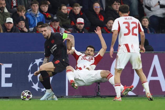 Robert Andrich (Bayer 04 Leverkusen) und Mehdi Taremi (Olympiacos FC) battle for the ball during the UEFA Champions League 2025 26 League Knockout Play-off Second Leg match between Bayer 04 Leverkusen and Olympiacos FC at BayArena on February 24, 2026 in Leverkusen, Germany. (Photo by Oliver Kaelke DeFodi Images) -