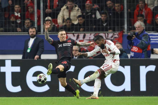 Alejandro Grimaldo (Bayer 04 Leverkusen) und Rodinei (Olympiacos FC) battle for the ball during the UEFA Champions League 2025 26 League Knockout Play-off Second Leg match between Bayer 04 Leverkusen and Olympiacos FC at BayArena on February 24, 2026 in Leverkusen, Germany. (Photo by Oliver Kaelke DeFodi Images) -