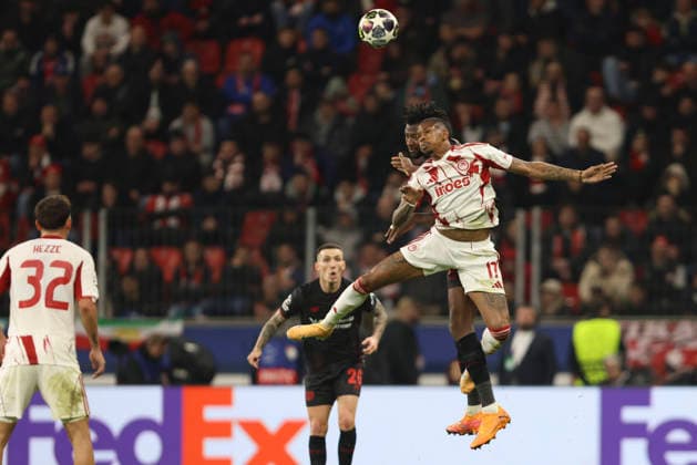 Edmond Tapsoba (Bayer 04 Leverkusen) und AndrÃ Luiz (Olympiacos FC) battle for the ball during the UEFA Champions League 2025 26 League Knockout Play-off Second Leg match between Bayer 04 Leverkusen and Olympiacos FC at BayArena on February 24, 2026 in Leverkusen, Germany. (Photo by Oliver Kaelke DeFodi Images) -
