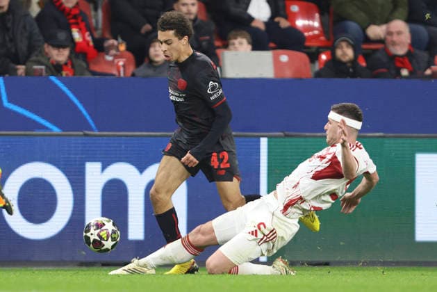 Montrell Culbreath (Bayer 04 Leverkusen) und Lorenzo Pirola (Olympiacos FC) battle for the ball during the UEFA Champions League 2025 26 League Knockout Play-off Second Leg match between Bayer 04 Leverkusen and Olympiacos FC at BayArena on February 24, 2026 in Leverkusen, Germany. (Photo by Oliver Kaelke DeFodi Images) -