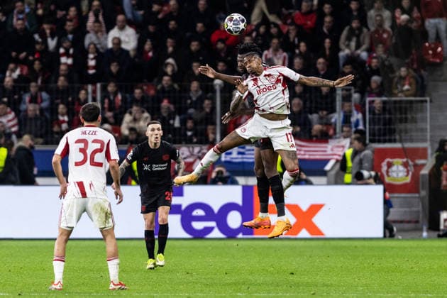 UEFA Champions League: Bayer 04 Leverkusen - Olympiacos FC; 24.02.2026 Edmond Tapsoba (Bayer 04 Leverkusen, 12), Andre Luiz (Olympiacos FC, 17) UEFA Champions League: Bayer 04 Leverkusen - Olympiacos FC; BayArena, Leverkusen; 24.02.2026 Copyright: xBEAUTIFULxSPORTS Buriakovx