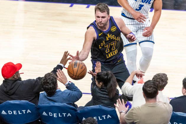 February 24, 2026, Los Angeles, California, USA: Los Angeles LakersÃ¢â‚¬â ¢ Luka DonÄÂiÄ¡ (77) chases the ball into the front row seats during an NBA, Basketball Herren, USA basketball game at Crypto.com Arena on Tuesday, Feb. 24, 2026 in Los Angeles. NBA 2026: Magic 110:109 Lakers  - ZUMAc68_ 20260224_zaf_c68_061 Copyright: xRingoxChiux