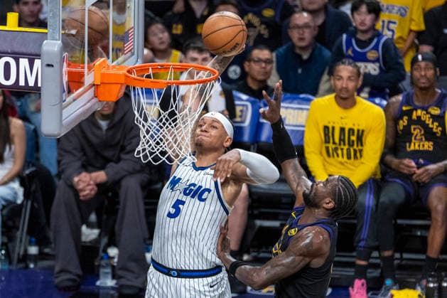 February 24, 2026, Los Angeles, California, USA: Orlando MagicÃ¢â‚¬â ¢s Paolo Banchero (5) dunks against Los Angeles LakersÃ¢â‚¬â ¢ Deandre Ayton (5) during an NBA, Basketball Herren, USA basketball game at Crypto.com Arena on Tuesday, Feb. 24, 2026 in Los Angeles. NBA 2026: Magic 110:109 Lakers  - ZUMAc68_ 20260224_zaf_c68_070 Copyright: xRingoxChiux