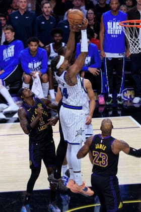 February 24, 2026, Los Angeles, California, USA: Wendell Carter Jr. 34 of the Orlando Magic makes a two point shot as Jarred Vanderbilt 2 and LeBron James 23 of the Los Angeles Lakers defend during their regular season NBA, Basketball Herren, USA game on Tuesday February 24, 2026 at Crypto.com Arena in Los Angeles, California. Lakers lose to Magic, 109-110. ARIANA RUIZ PI Lakers Vs. Magic  - ZUMAp124 20260224_zaa_p124_030 Copyright: xArianaxRuizx