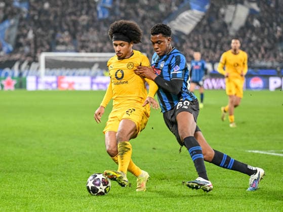 Karim Adeyemi (Borussia Dortmund) and Honest Ahanor (Atalanta BC) battle for the ball during the UEFA Champions League 2025 26 League Knockout Play-off Second Leg match between Atalanta BC and Borussia Dortmund at Stadio di Bergamo on February 25, 2026 in Bergamo, Italy. (Photo by Harry Langer DeFodi Images) -