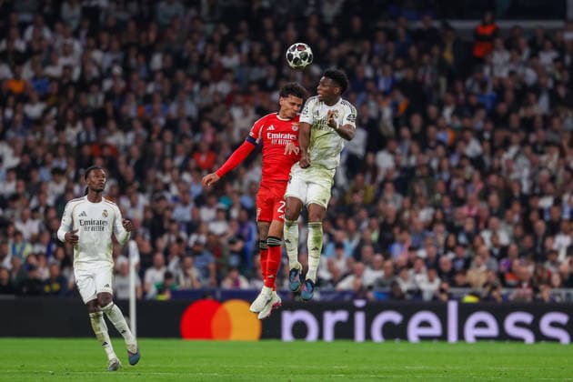 Madrid, Spain February 25, 2026: FBL-UEFA Champions League 2025-26 Real Madrid - SL Benfica Richard Rios (S.L.Benfica), Aurelien Tchouameni (Real Madrid) battles for the Ball during the UEFA Champions League 2025-26 knockout play-offs match between Real Madrid and SL Benfica at the Santiago BernabÃ u Stadium on February 25, 2026 in Madrid, Spain Copyright: JoaquimxFerreira