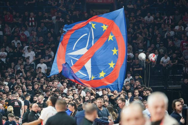 February 25, 2026, Belgrade, Vojvodina province, Serbia: 2026225, Belgrade, Serbia - Red Star Belgrade fans wave anti EU and anti NATO flag during the EuroLeague regular season game between Crvena Zvezda and Anadolu Efes at the Belgrade Arena. Basketball 2026: EuroLeague: Crvena Zvezda Meridianbet 91:81 Anadolu Efes Istanbul  - ZUMAd223 20260225_zip_d223_004 Copyright: xMarkoxDimicx