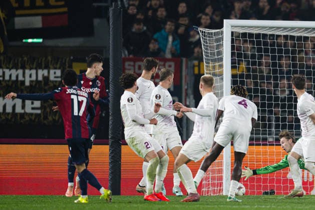 260226 Joao Mario of Bologna scores the 1-0 goal behind goalkeeper Mathias Dyngeland of Brann during the UEFA Europa League football match between Bologna and Brann on February 26, 2026 in Bologna. Photo: Marius Simensen BILDBYRAN COP 238 MM0058 bbeng bologna brann football fotball fotboll soccer uefa europa league Copyright: MARIUSxSIMENSEN BB260226ZB019