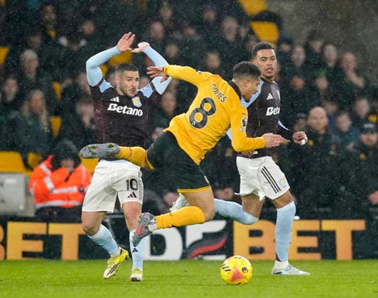 Wolverhampton, England, 27th February 2026. Emiliano Buendia of Aston Villa (l) avoids Joao Gomes of Wolverhampton Wanderers (r) during the Wolverhampton Wanderers vs Aston Villa Premier League match at Molineux, Wolverhampton. Picture credit should read: Andrew Yates Sportimage EDITORIAL USE ONLY. No use with unauthorised audio, video, data, fixture lists, club league logos or live services. Online in-match use limited to 120 images, no video emulation. No use in betting, games or single club league player publications. SPI_021_AY_Wolves_Villa SPI-4564-0021
