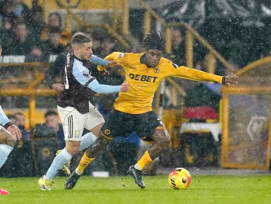 Wolverhampton, England, 27th February 2026. Emiliano Buendia of Aston Villa tackles Jean-Ricner Bellegarde of Wolverhampton Wanderers during the Wolverhampton Wanderers vs Aston Villa Premier League match at Molineux, Wolverhampton. Picture credit should read: Andrew Yates Sportimage EDITORIAL USE ONLY. No use with unauthorised audio, video, data, fixture lists, club league logos or live services. Online in-match use limited to 120 images, no video emulation. No use in betting, games or single club league player publications. SPI_032_AY_Wolves_Villa SPI-4564-0032