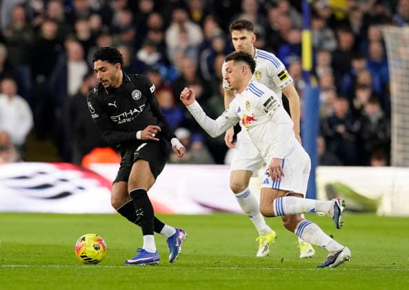 Leeds, England, 28th February 2026. Omar Marmoush of Manchester City and Ethan Ampadu of Leeds United during the Leeds United vs Manchester City Premier League match at Elland Road, Leeds. Picture credit should read: Andrew Yates Sportimage EDITORIAL USE ONLY. No use with unauthorised audio, video, data, fixture lists, club league logos or live services. Online in-match use limited to 120 images, no video emulation. No use in betting, games or single club league player publications. SPI_035_AY_Leeds_Man_City SPI-4565-0035