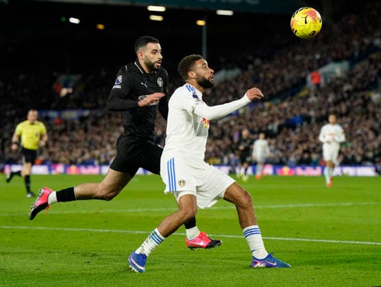 Leeds, England, 28th February 2026. Rayan Alt-Nouri of Manchester City challenges Jayden Bogle of Leeds United during the Leeds United vs Manchester City Premier League match at Elland Road, Leeds. Picture credit should read: Andrew Yates Sportimage EDITORIAL USE ONLY. No use with unauthorised audio, video, data, fixture lists, club league logos or live services. Online in-match use limited to 120 images, no video emulation. No use in betting, games or single club league player publications. SPI_049_AY_Leeds_Man_City SPI-4565-0049