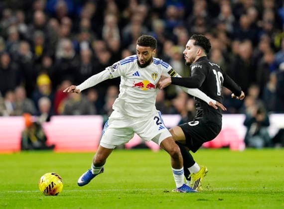 Leeds, England, 28th February 2026. Jayden Bogle of Leeds United and Rayan Cherki of Manchester City during the Leeds United vs Manchester City Premier League match at Elland Road, Leeds. Picture credit should read: Andrew Yates Sportimage EDITORIAL USE ONLY. No use with unauthorised audio, video, data, fixture lists, club league logos or live services. Online in-match use limited to 120 images, no video emulation. No use in betting, games or single club league player publications. SPI_050_AY_Leeds_Man_City SPI-4565-0050