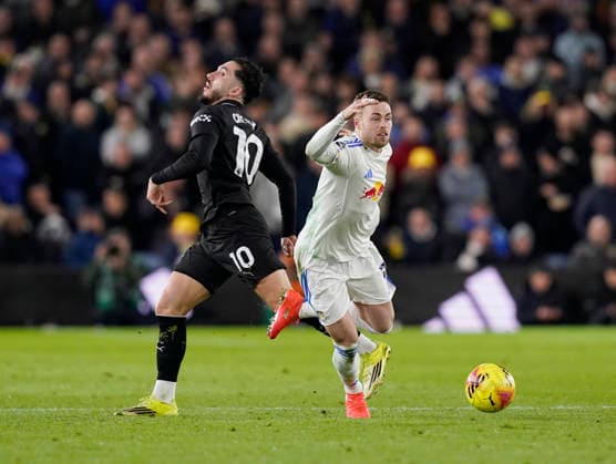 Leeds, England, 28th February 2026. Rayan Cherki of Manchester City tackled by Gabriel Gudmundsson of Leeds United during the Leeds United vs Manchester City Premier League match at Elland Road, Leeds. Picture credit should read: Andrew Yates Sportimage EDITORIAL USE ONLY. No use with unauthorised audio, video, data, fixture lists, club league logos or live services. Online in-match use limited to 120 images, no video emulation. No use in betting, games or single club league player publications. SPI_062_AY_Leeds_Man_City SPI-4565-0062