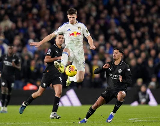 Leeds, England, 28th February 2026. Anton Stach of Leeds United leaps up in front of Tijjani Reijnders of Manchester City (r) during the Leeds United vs Manchester City Premier League match at Elland Road, Leeds. Picture credit should read: Andrew Yates Sportimage EDITORIAL USE ONLY. No use with unauthorised audio, video, data, fixture lists, club league logos or live services. Online in-match use limited to 120 images, no video emulation. No use in betting, games or single club league player publications. SPI_088_AY_Leeds_Man_City SPI-4565-0089