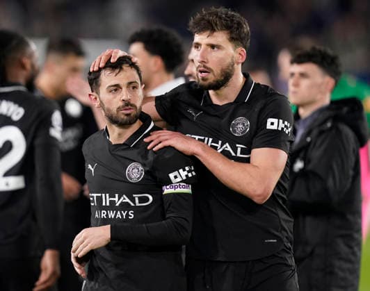Leeds, England, 28th February 2026. Bernardo Silva of Manchester City and Ruben Dias of Manchester City celebrate the win during the Leeds United vs Manchester City Premier League match at Elland Road, Leeds. Picture credit should read: Andrew Yates Sportimage EDITORIAL USE ONLY. No use with unauthorised audio, video, data, fixture lists, club league logos or live services. Online in-match use limited to 120 images, no video emulation. No use in betting, games or single club league player publications. SPI_099_AY_Leeds_Man_City SPI-4565-0099
