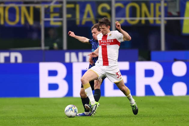 Morten Frendrup (Genoa Cfc) und Nicolo Barella (Fc Internazionale) battle for the ball, Serie A, FC Internazionale v Genoa CFC, Giuseppe Meazza, February 28, 2026, Milan, Italy.