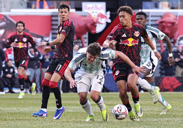 February 28, 2026, Harrison, New Jersey, USA: New England Revolution defender Ilay Feingold (12) falls as he passes between New York Red Bulls forward Jorge Ruvalcaba (11) and New York Red Bulls forward Julian Hall (16) at Sports Illustrated Stadium. MLS, Fussball Herren, USA 2026: New England Revolution 0:1 New York Red Bulls  - ZUMAs325 20260228_zsp_s325_023 Copyright: xJessxStilesx