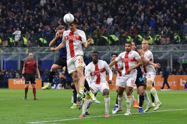Milan, Italy, 28th February 2026. Morten Frendrup of Genoa CFC heads a corner clear as he is challenged by Davide Frattesi of FC Internazionale during the Internazionale vs Genoa Serie A match at Giuseppe Meazza, Milan. Picture credit should read: Jonathan Moscrop Sportimage EDITORIAL USE ONLY. No use with unauthorised audio, video, data, fixture lists, club league logos or live services. Online in-match use limited to 120 images, no video emulation. No use in betting, games or single club league player publications. SPI_031_INTER_GENOA_ SPI-4553-0029