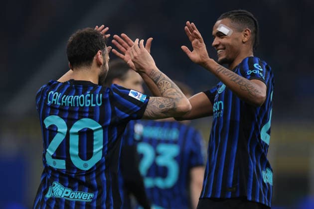 Milan, Italy, 28th February 2026. Hakan Calhanoglu of FC Internazionale celebrates with team mate Manuel Akanji after scoring a second half penalty to give the side a 2-0 lead during the Internazionale vs Genoa Serie A match at Giuseppe Meazza, Milan. Picture credit should read: Jonathan Moscrop Sportimage EDITORIAL USE ONLY. No use with unauthorised audio, video, data, fixture lists, club league logos or live services. Online in-match use limited to 120 images, no video emulation. No use in betting, games or single club league player publications. SPI_036_INTER_GENOA_ SPI-4553-0036