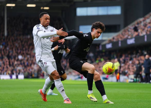 1st March 2026; Craven Cottage, Fulham, London, England; Premier League Football, Fulham versus Tottenham Hotspur; Archie Gray of Tottenham Hotspur under pressure from Kenny Tete of Fulham  JPxFletcher Content restricted for UK based newspaper