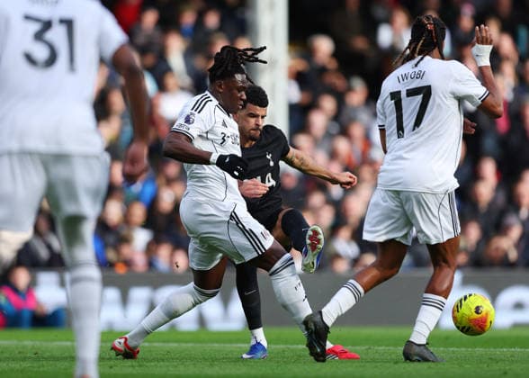 1st March 2026; Craven Cottage, Fulham, London, England; Premier League Football, Fulham versus Tottenham Hotspur; Dominic Solanke of Tottenham Hotspur under pressure from Calvin Bassey of Fulham  JPxFletcher Content restricted for UK based newspaper