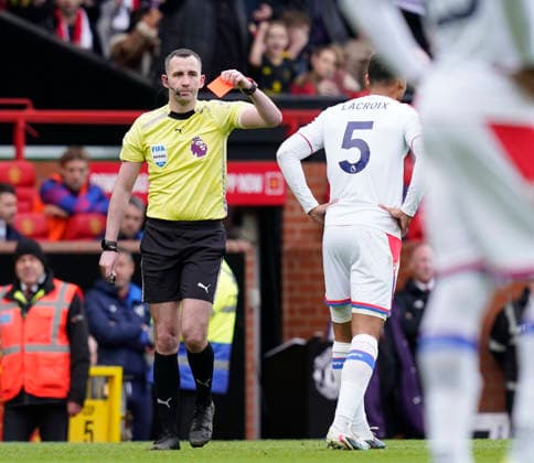 Manchester, England, 1st March 2026. Maxence Lacroix of Crystal Palace is shown the red card during the Manchester United, ManU vs Crystal Palace Premier League match at Old Trafford, Manchester. Picture credit should read: Andrew Yates Sportimage EDITORIAL USE ONLY. No use with unauthorised audio, video, data, fixture lists, club league logos or live services. Online in-match use limited to 120 images, no video emulation. No use in betting, games or single club league player publications. SPI_038_AY_Man_Utd_Palace SPI-4566-0038