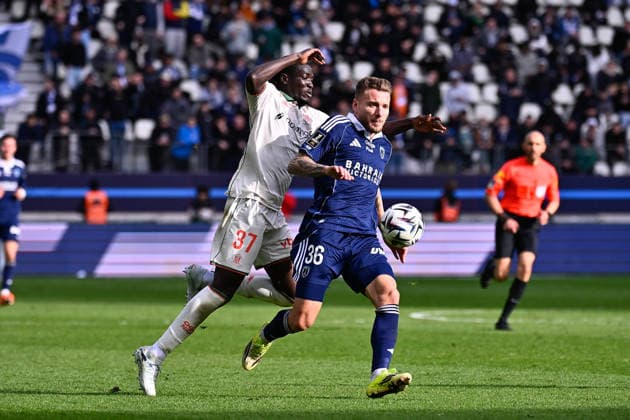 FOOTBALL : Paris FC vs Nice - Ligue 1 - 01 03 2026 Ciro Immobile ( 36 - PFC ) and Kojo Peprah Oppong ( 37 - Nice ) during the Ligue 1 match between Paris FC and OGC Nice at Stade Jean Bouin on March 01, 2026 in Paris, France. ( Photo by Federico Pestellini PsnewZ ) - ParisFrance  Copyright: xFedericoxPestelinix